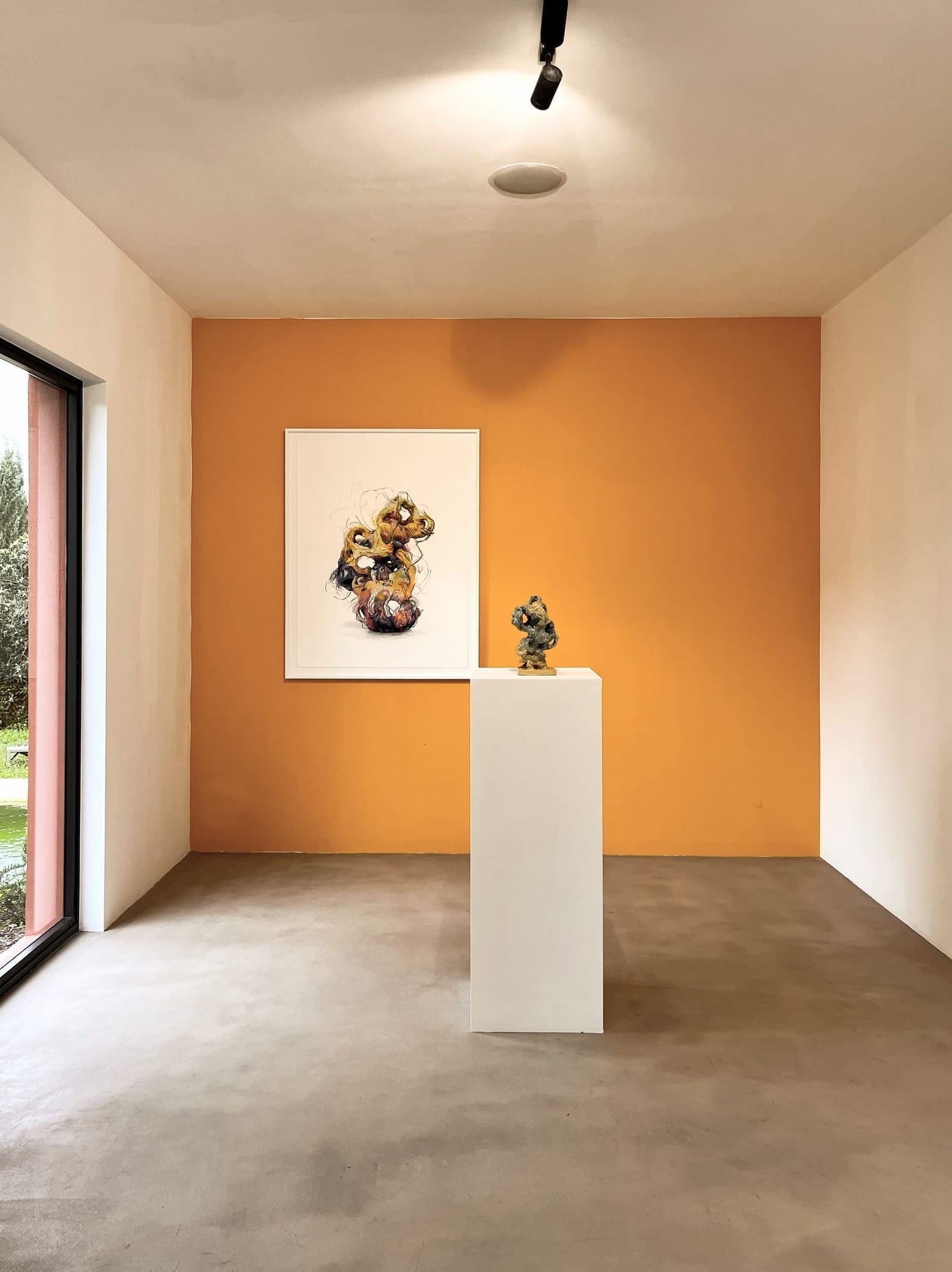 Toile Blanche — a work against the gallery's orange wall
